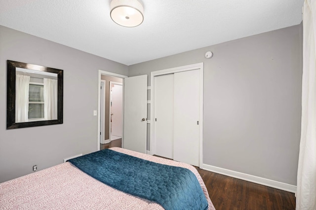 579 36th Ave NE, Minneapolis, MN 55418 - bedroom featuring dark wood-type flooring and a closet