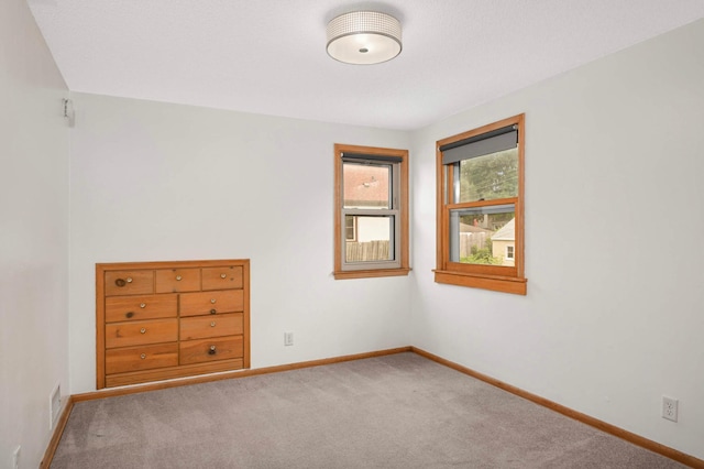 579 36th Ave NE, Minneapolis, MN 55418 - carpeted empty room featuring baseboards