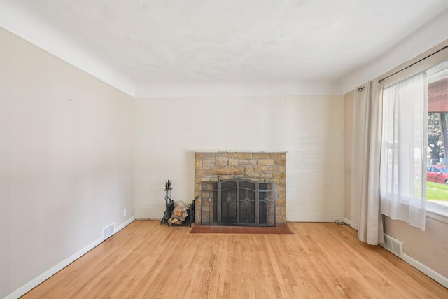 272 Butler Ave E, West Saint Paul, MN 55118 - unfurnished living room with wood finished floors and a fireplace