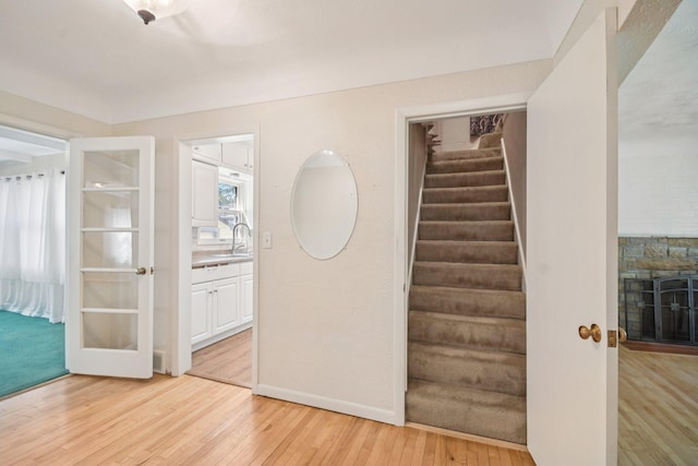 272 Butler Ave E, West Saint Paul, MN 55118 - stairway with hardwood / wood-style floors and a fireplace
