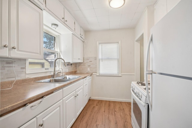 272 Butler Ave E, West Saint Paul, MN 55118 - kitchen featuring white appliances, decorative backsplash, white cabinets, and light wood finished floors