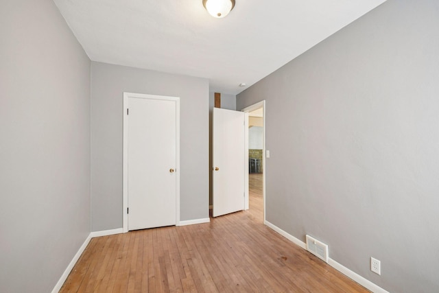 272 Butler Ave E, West Saint Paul, MN 55118 - unfurnished bedroom with baseboards and light wood-type flooring
