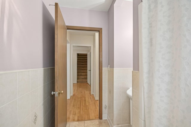 272 Butler Ave E, West Saint Paul, MN 55118 - corridor featuring tile walls, wainscoting, and light tile patterned flooring