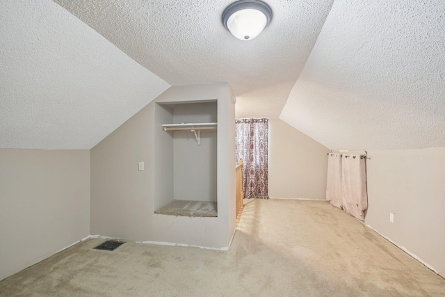 272 Butler Ave E, West Saint Paul, MN 55118 - bonus room featuring a textured ceiling, carpet flooring, and lofted ceiling