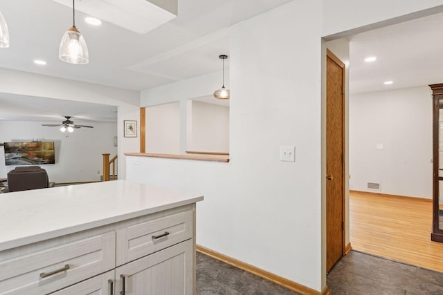 16059 Kettle River Blvd NE, Columbus, MN 55025 - kitchen with light countertops, ceiling fan, decorative light fixtures, recessed lighting, and open floor plan