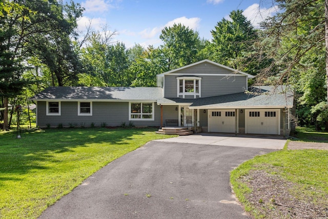 16059 Kettle River Blvd NE, Columbus, MN 55025 - view of front facade featuring asphalt driveway, roof with shingles, a front yard, and a garage
