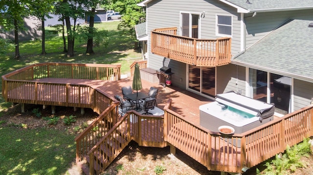 16059 Kettle River Blvd NE, Columbus, MN 55025 - wooden deck with a hot tub, a grill, stairway, and a lawn
