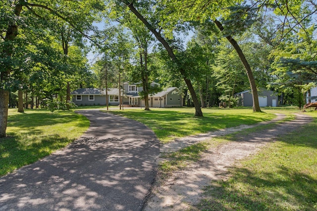 16059 Kettle River Blvd NE, Columbus, MN 55025 - view of front of property with a front yard, driveway, and view of wooded area