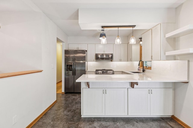 16059 Kettle River Blvd NE, Columbus, MN 55025 - kitchen with a peninsula, appliances with stainless steel finishes, light countertops, open shelves, and backsplash