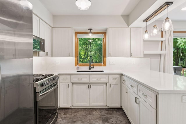 16059 Kettle River Blvd NE, Columbus, MN 55025 - kitchen featuring appliances with stainless steel finishes, open shelves, white cabinetry, and light countertops