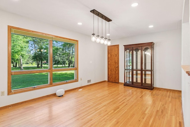 16059 Kettle River Blvd NE, Columbus, MN 55025 - spare room with wood finished floors and recessed lighting
