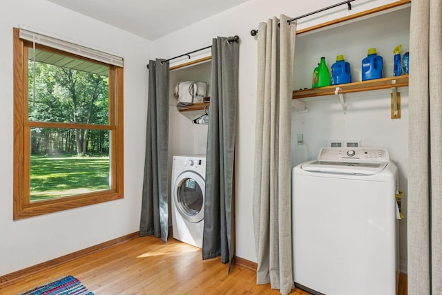 16059 Kettle River Blvd NE, Columbus, MN 55025 - washroom featuring washer / dryer and light wood-type flooring