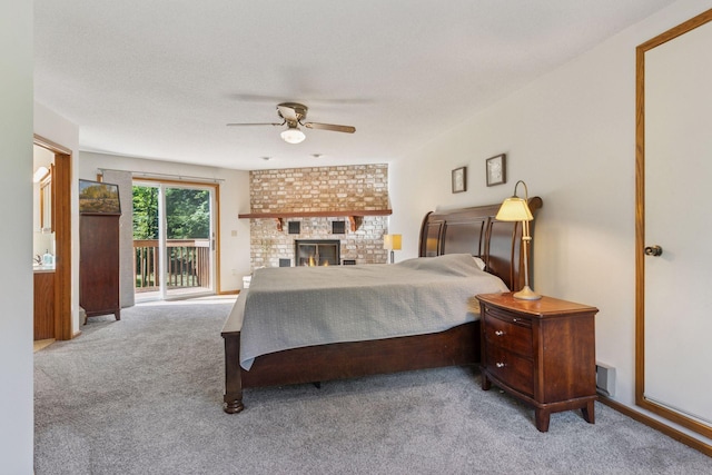 16059 Kettle River Blvd NE, Columbus, MN 55025 - bedroom with access to outside, carpet, ceiling fan, and a fireplace