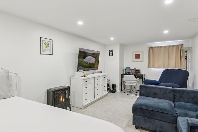16059 Kettle River Blvd NE, Columbus, MN 55025 - bedroom featuring recessed lighting, light wood-style floors, and a wood stove