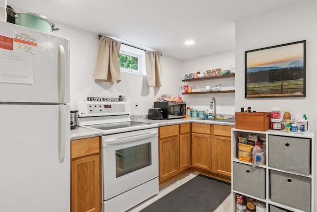 16059 Kettle River Blvd NE, Columbus, MN 55025 - kitchen with white appliances, light countertops, open shelves, and brown cabinetry