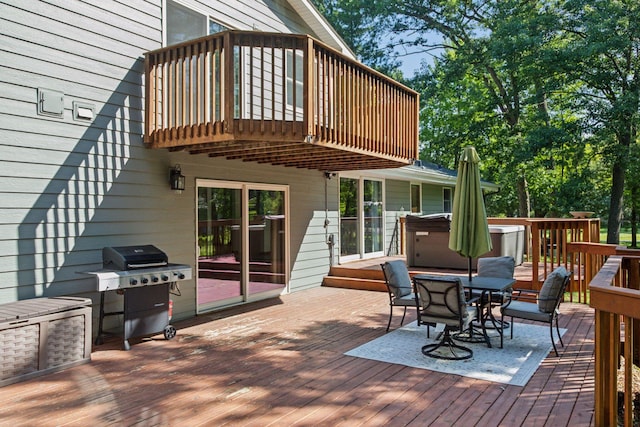 16059 Kettle River Blvd NE, Columbus, MN 55025 - wooden deck featuring a hot tub, outdoor dining area, and grilling area