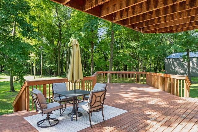 16059 Kettle River Blvd NE, Columbus, MN 55025 - wooden deck featuring outdoor dining area and a lawn