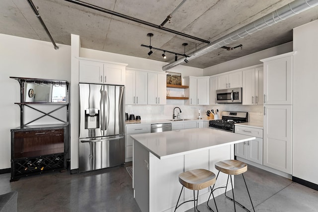 730 4th St Unit 601, Minneapolis, MN 55401 - kitchen with appliances with stainless steel finishes, open shelves, finished concrete floors, and white cabinetry