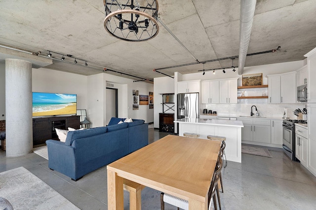 730 4th St Unit 601, Minneapolis, MN 55401 - dining room featuring finished concrete flooring and rail lighting