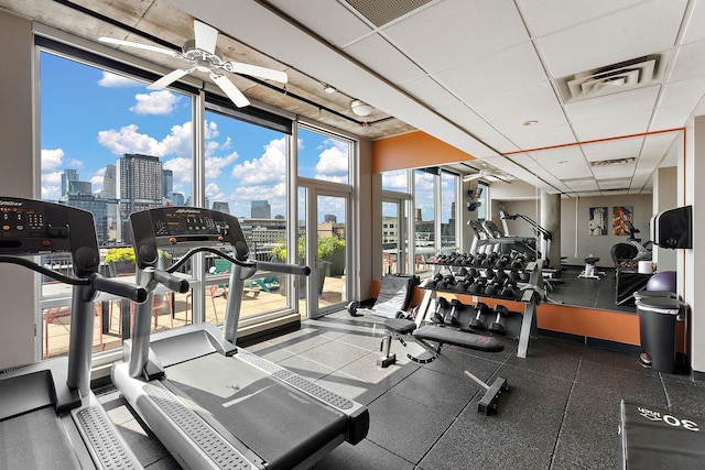 730 4th St Unit 601, Minneapolis, MN 55401 - exercise room featuring a skyline view, ceiling fan, a wall of windows, and a drop ceiling