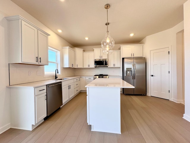 11367 84th St NE, Otsego, MN 55330 - kitchen featuring stainless steel appliances, light countertops, backsplash, white cabinetry, and recessed lighting