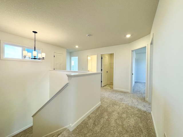 11367 84th St NE, Otsego, MN 55330 - hall with an upstairs landing, light carpet, a chandelier, recessed lighting, and a textured ceiling