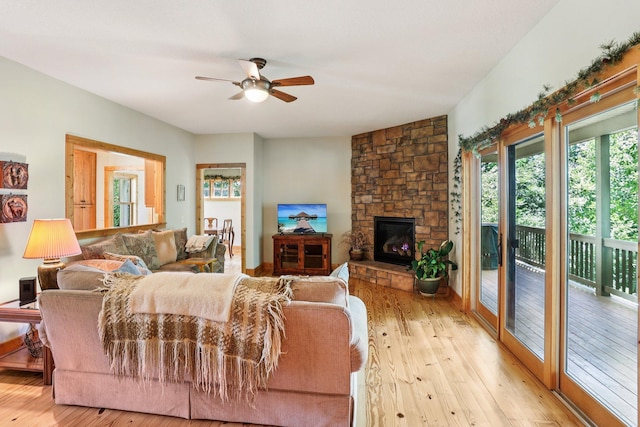 31338 Oasis Rd, Center City, MN 55012 - living room featuring a ceiling fan, light wood finished floors, and a fireplace
