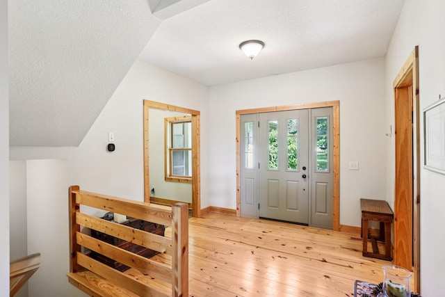 31338 Oasis Rd, Center City, MN 55012 - foyer featuring light wood finished floors and a textured ceiling