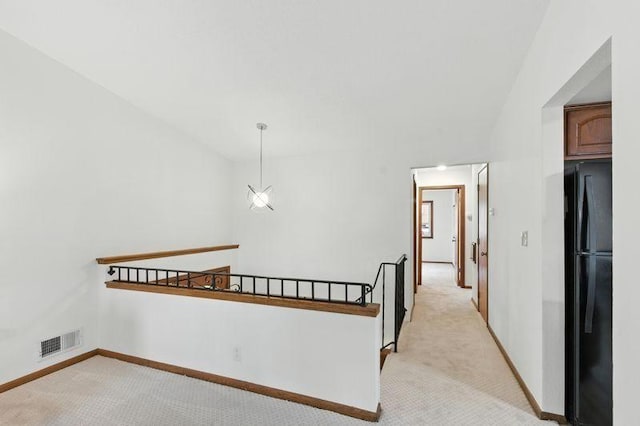 1821 Wilson Ave, Saint Paul, MN 55106 - hall featuring light carpet and an upstairs landing