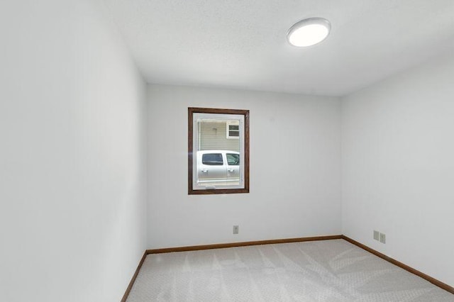 1821 Wilson Ave, Saint Paul, MN 55106 - unfurnished room with light colored carpet