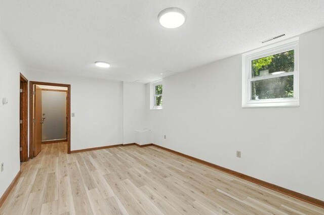 1821 Wilson Ave, Saint Paul, MN 55106 - empty room featuring light wood-style flooring and baseboards