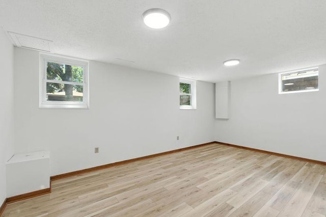 1821 Wilson Ave, Saint Paul, MN 55106 - below grade area featuring light wood-style flooring and healthy amount of natural light