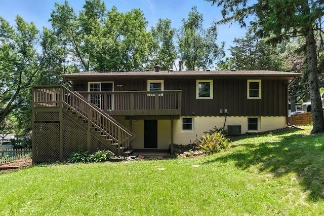 1821 Wilson Ave, Saint Paul, MN 55106 - rear view of property featuring stairway, a wooden deck, and board and batten siding