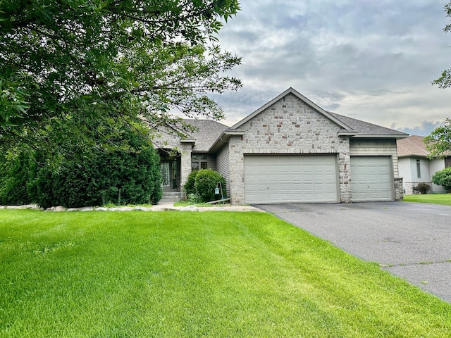 22813 Zion Pkwy NW, Oak Grove, MN 55303 - view of front of property featuring a garage, driveway, stone siding, and a front lawn