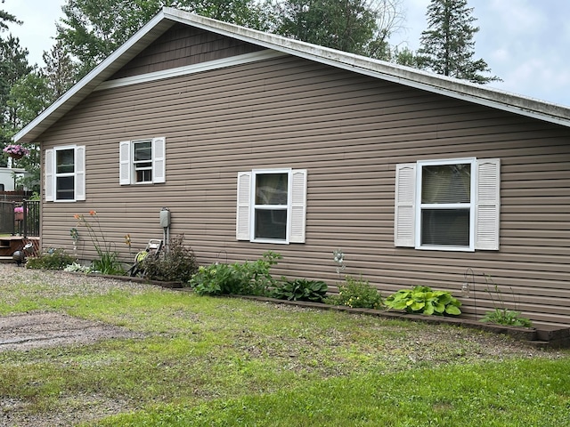 406 State 6 S, Remer, MN 56672 - view of side of home featuring a yard
