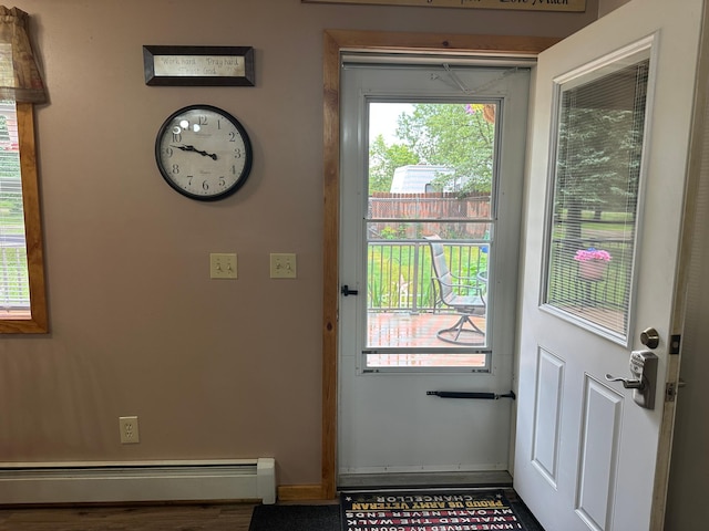 406 State 6 S, Remer, MN 56672 - entryway with a baseboard heating unit and baseboards