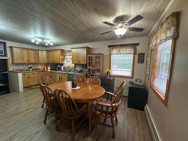 406 State 6 S, Remer, MN 56672 - dining space with baseboard heating, crown molding, a ceiling fan, wood finished floors, and wood ceiling