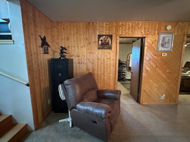 406 State 6 S, Remer, MN 56672 - living area featuring carpet flooring, wooden walls, and stairway