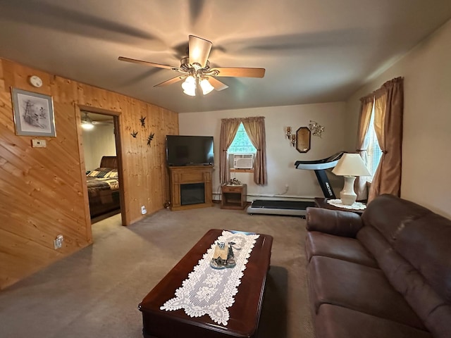 406 State 6 S, Remer, MN 56672 - living room with ceiling fan, wood walls, carpet flooring, cooling unit, and a fireplace