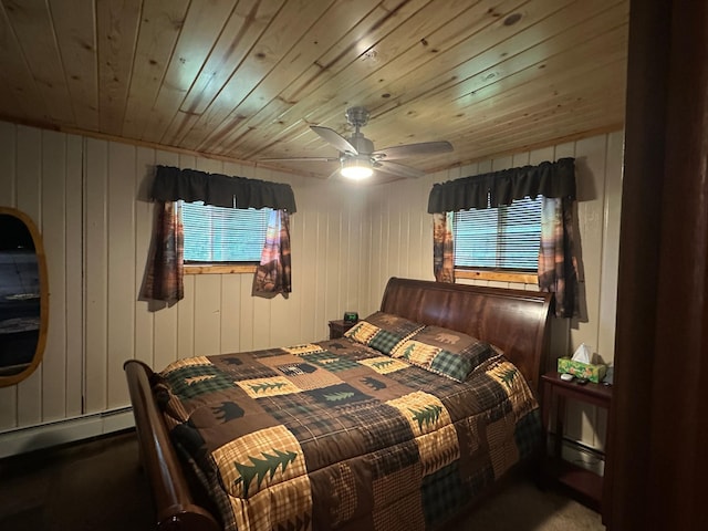 406 State 6 S, Remer, MN 56672 - bedroom featuring multiple windows, a baseboard heating unit, wooden ceiling, a ceiling fan, and carpet
