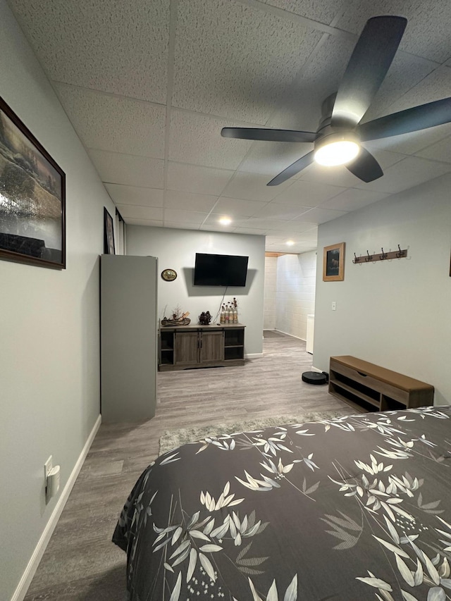 406 State 6 S, Remer, MN 56672 - bedroom with a paneled ceiling, wood finished floors, and a ceiling fan