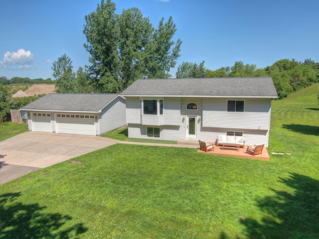 3205 Adair Ave NE, Buffalo, MN 55313 - raised ranch featuring outdoor lounge area, a garage, a front lawn, and concrete driveway