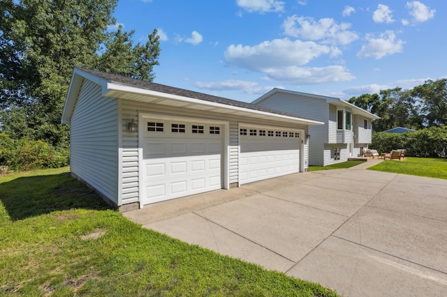 3205 Adair Ave NE, Buffalo, MN 55313 - view of side of home with a yard, driveway, and an attached garage