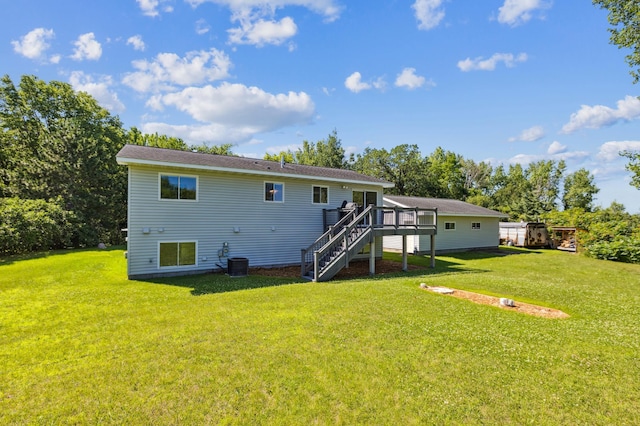 3205 Adair Ave NE, Buffalo, MN 55313 - back of house featuring stairway, a wooden deck, and a yard