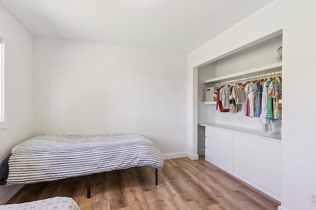 3205 Adair Ave NE, Buffalo, MN 55313 - bedroom with light wood-style floors and baseboards