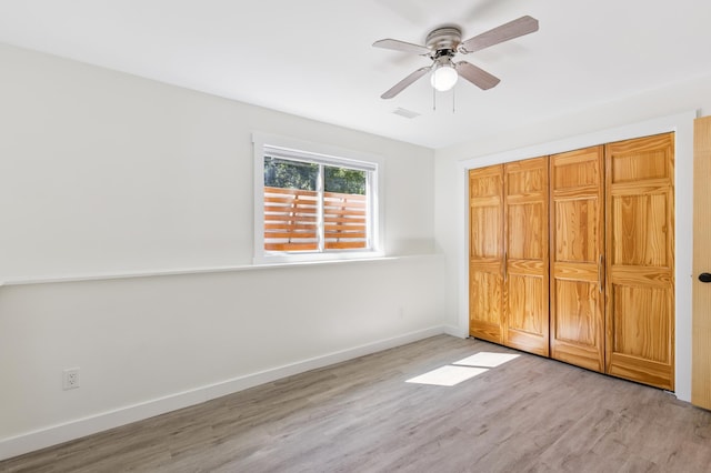 3205 Adair Ave NE, Buffalo, MN 55313 - unfurnished bedroom with wood finished floors, a closet, and ceiling fan