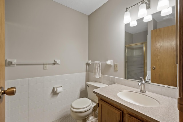 14575 Burma Ave W Unit 205, Rosemount, MN 55068 - full bath featuring a shower stall, tile walls, vanity, and a wainscoted wall
