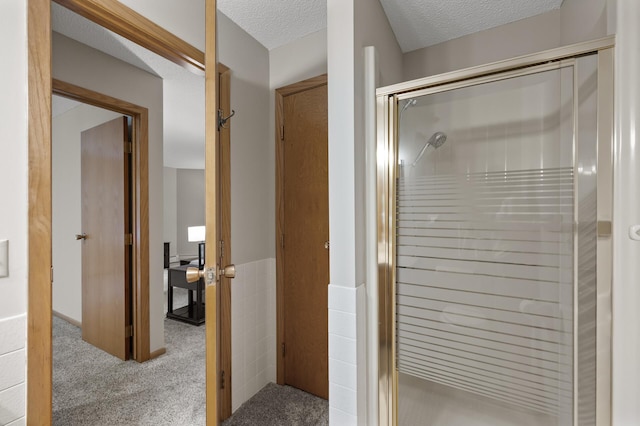 14575 Burma Ave W Unit 205, Rosemount, MN 55068 - full bathroom featuring a stall shower and a textured ceiling