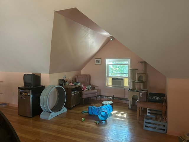 1636 Minnehaha Ave W, Saint Paul, MN 55104 - bonus room featuring cooling unit, wood finished floors, vaulted ceiling, and baseboard heating