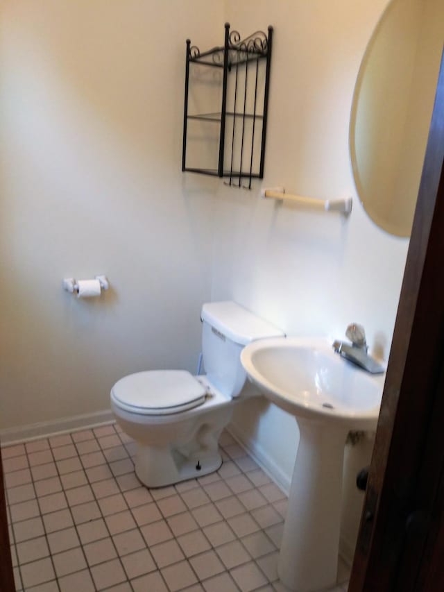 1636 Minnehaha Ave W, Saint Paul, MN 55104 - half bathroom featuring toilet and tile patterned floors